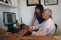 Dr. Mark Souweidane reviews MRI scans of DIPG tumors with Fatima Nathalia Morales.
