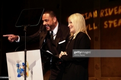 NEW YORK, NEW YORK - NOVEMBER 13: James Cruz (L) and Lizzie Grubman speak onstage at the 11th Annual Cristian Rivera Foundation Celebrity Gala on November 13, 2019 in New York City. (Photo by Johnny Nunez/WireImage)